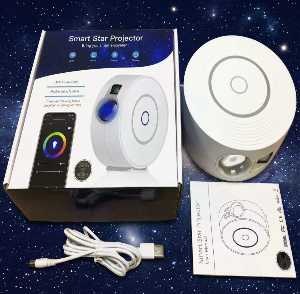 The white halo star projector shown next to its retail box, user manual and USB power cable on starry background